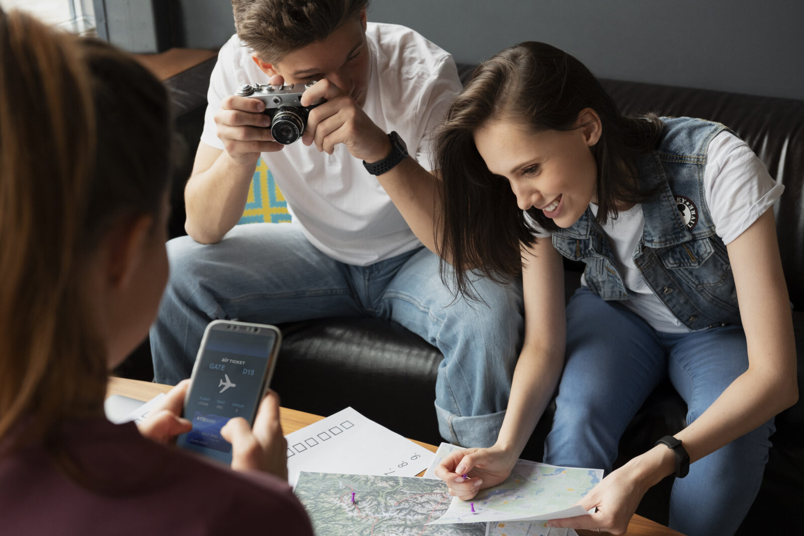 close-friends-planning-trip-with-map